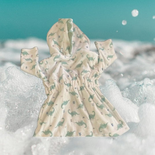 This hooded bathrobe features a fun and stylish dinosaur pattern