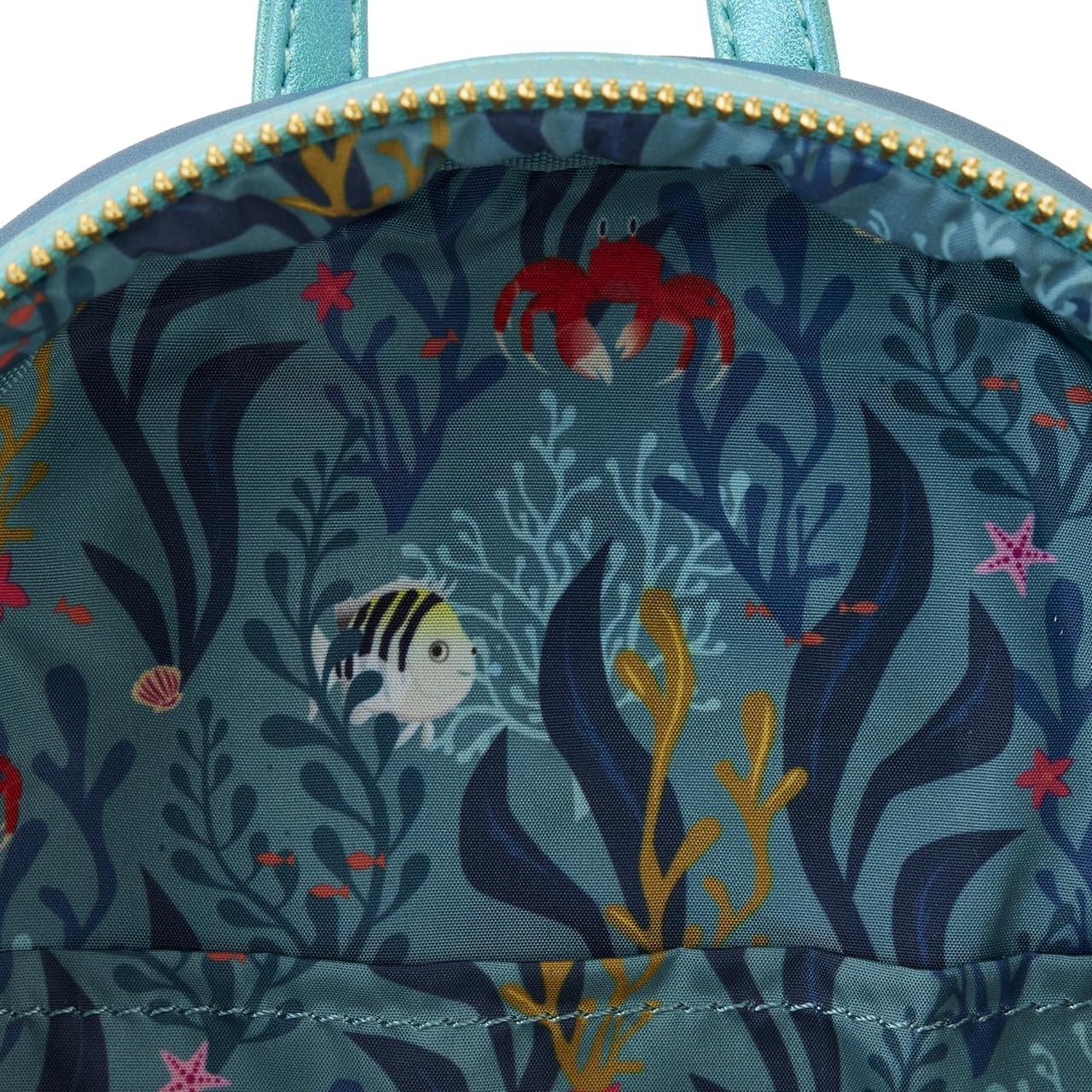 Experience the magic of Disney's Little Mermaid with this officially licensed faux leather mini backpack