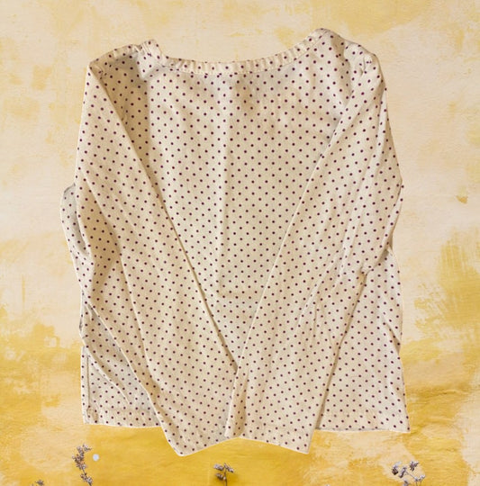This Wonderkids polka dot long sleeve top is a stylish addition to any toddler's wardrobe