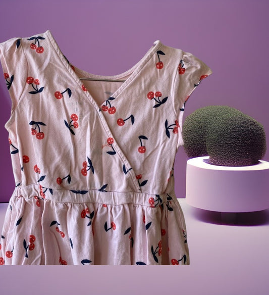 Dress up your little girl in this Carter's playful and colorful cherry design dress
