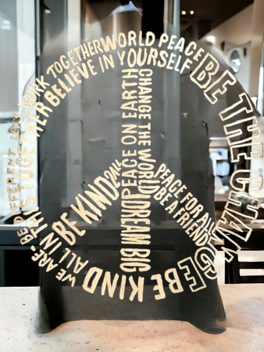 Black graphic tee featuring a pattern of inspirational sayings