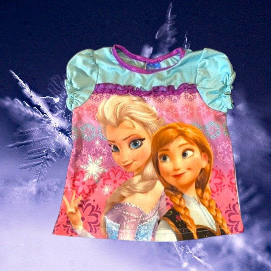 Disney's Elsa and Anna pajama top is perfect for Frozen fans and your little one will love wearing it to bed every night