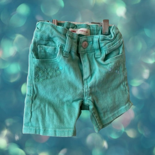 Jean shorts with unique heart-shaped pockets and dazzling sequins