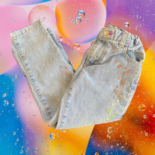 Featuring a unique appliqué design of glitter hearts and stars, these Healthtex jeans are very pretty and fashionable