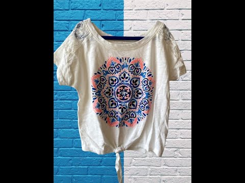 This Justice Girl's Lace Top features a striking blend of colors, enhanced by glitter and rhinestones