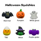 Set of Halloween-themed squishies with labels on a white background