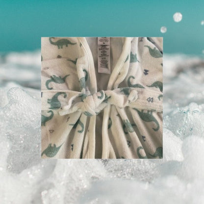 This hooded bathrobe features a fun and stylish dinosaur pattern