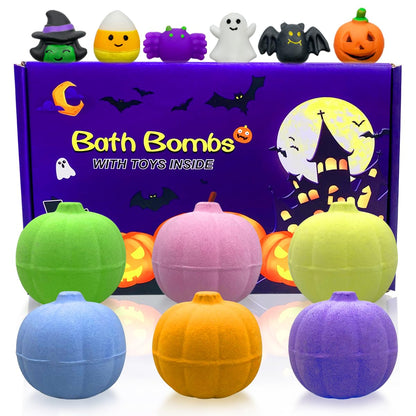 Halloween-themed bath bombs with toys inside, displayed in front of a decorative box.
