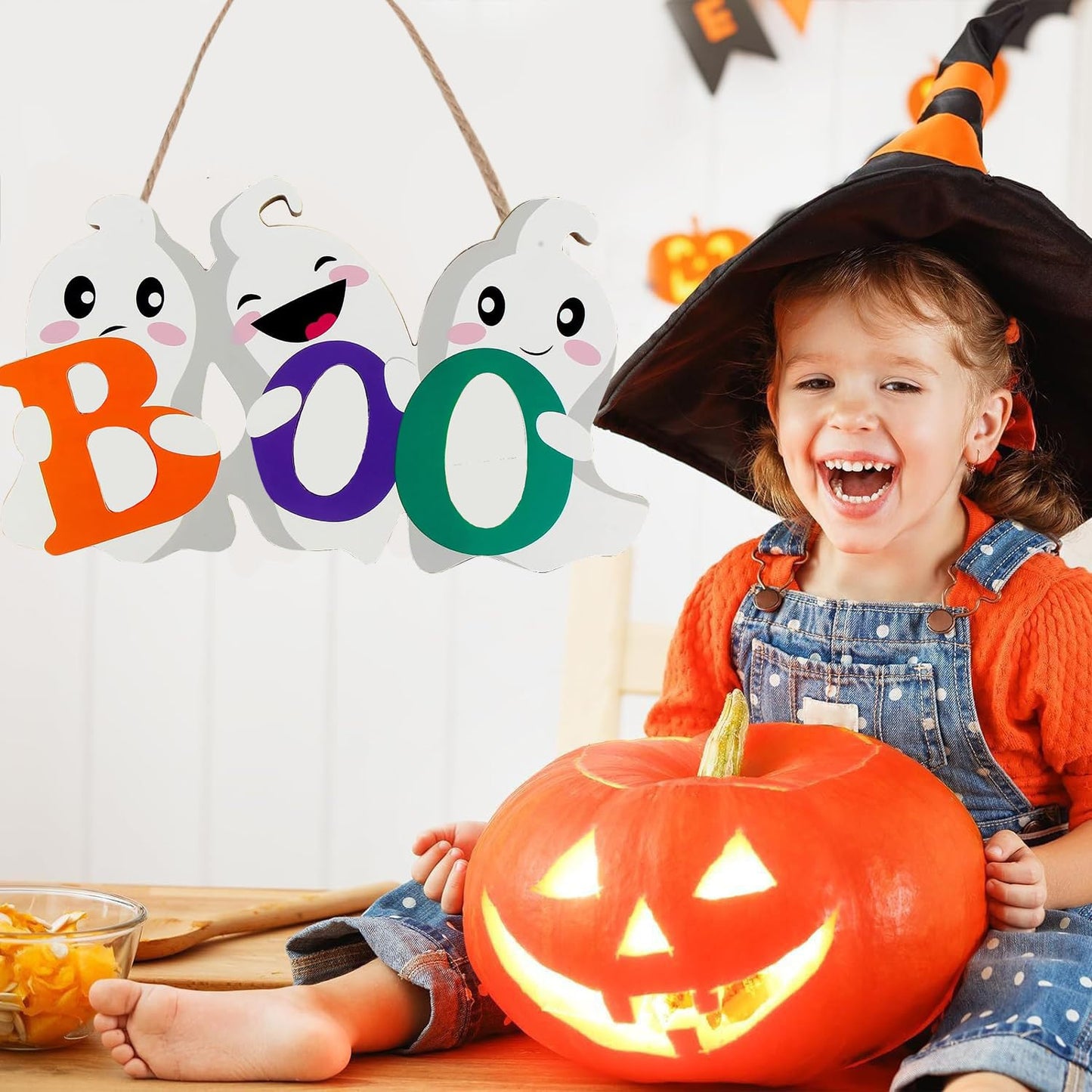 Enhance your Halloween decorations with this BOO wooden ghost sign set