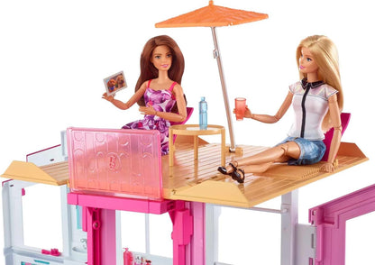 This Barbie doll townhouse boasts three levels of play space and fun