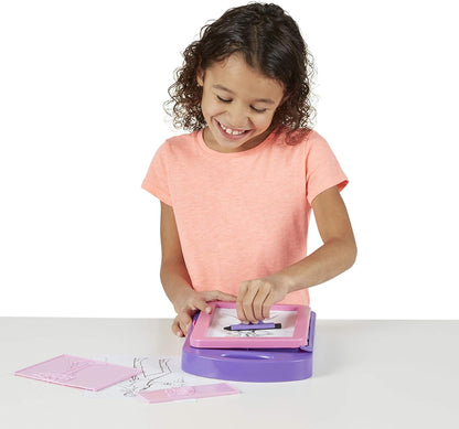 The Melissa & Doug fashion design kit includes everything needed for simple and fun fashion plate rubbings