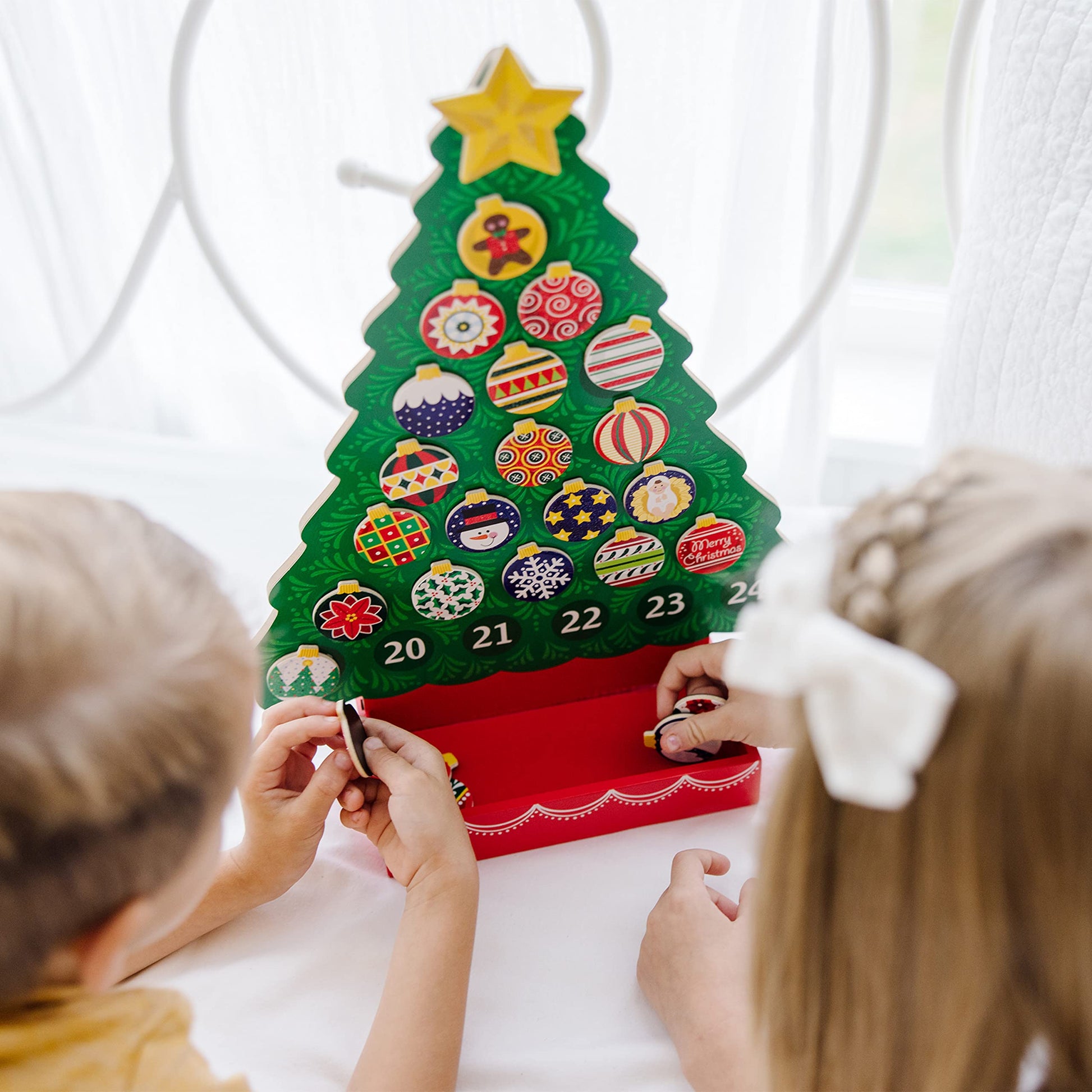 Enhance the holiday spirit in your household with the Melissa & Doug Wooden Advent Calendar