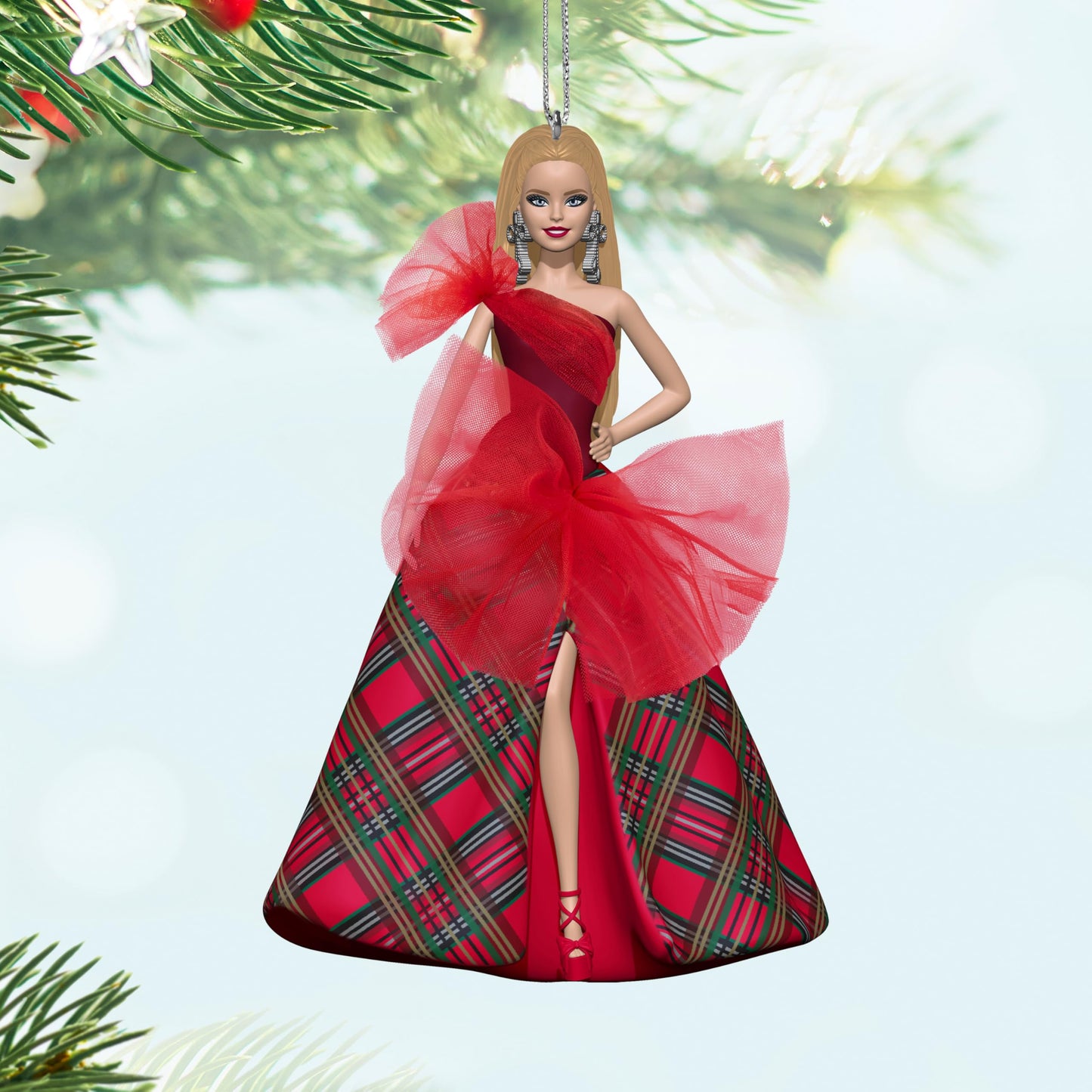 Inspired by this year's new Holiday Barbie Doll, the 2024 Holiday Barbie Hallmark Keepsake Christmas ornament adds a dazzling touch of glamour to the tree