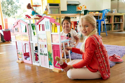 This Barbie doll townhouse boasts three levels of play space and fun