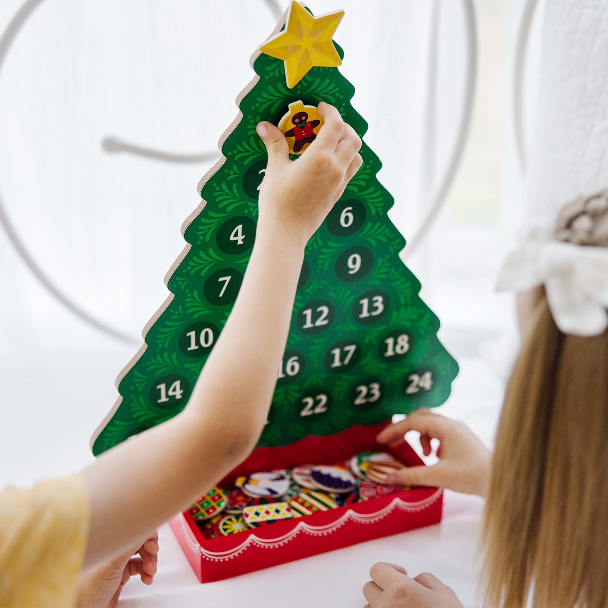 Enhance the holiday spirit in your household with the Melissa & Doug Wooden Advent Calendar