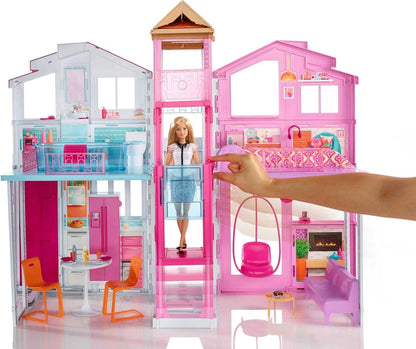 This Barbie doll townhouse boasts three levels of play space and fun