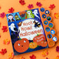 Halloween-themed children's book with sound buttons on an orange background with colorful leaves.
