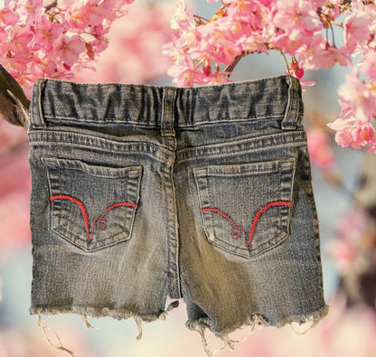 Get your girl ready for warmer weather with our cool Piper sequin denim frayed shorts