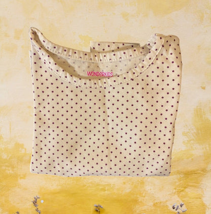 This Wonderkids polka dot long sleeve top is a stylish addition to any toddler's wardrobe