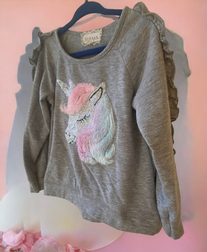 This grey multicolor sweatshirt features a unicorn applique and sequins