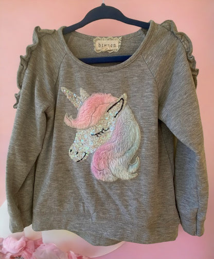 This grey multicolor sweatshirt features a unicorn applique and sequins