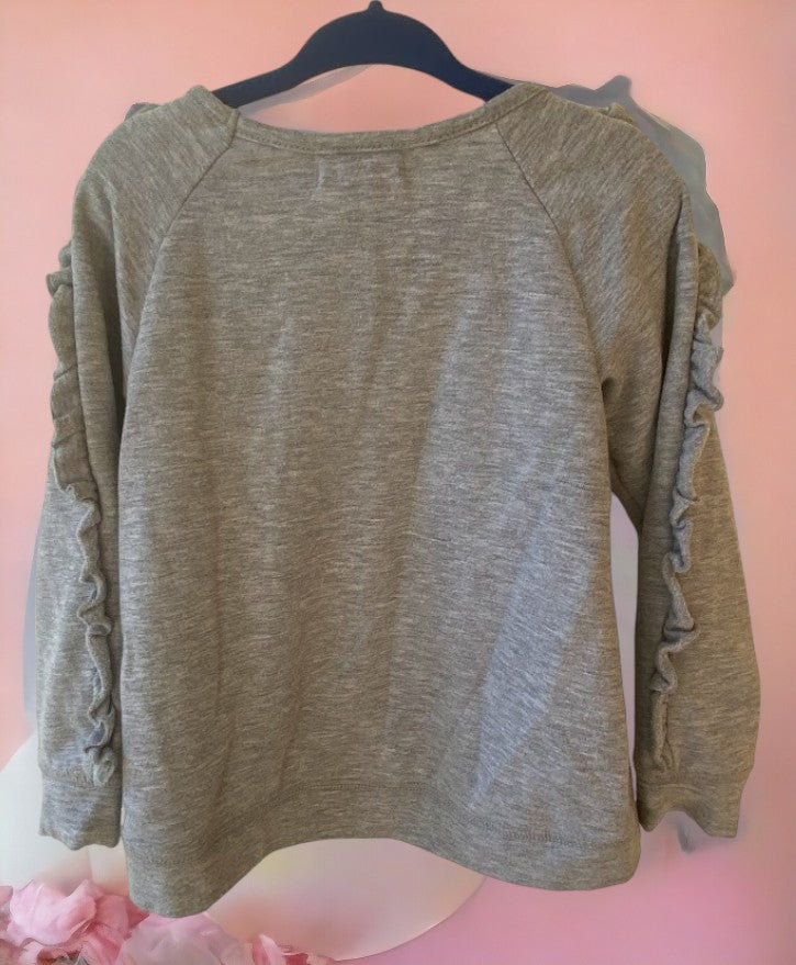 This grey multicolor sweatshirt features a unicorn applique and sequins