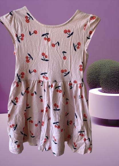 Dress up your little girl in this Carter's playful and colorful cherry design dress