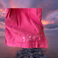 This girl's pink dress features a sleeveless design with a heart pattern making it a perfect dress for summer