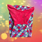 This cozy mermaid design tail blanket has beautiful colors and a fun design