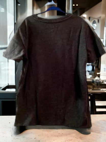 Black graphic tee featuring a pattern of inspirational sayings