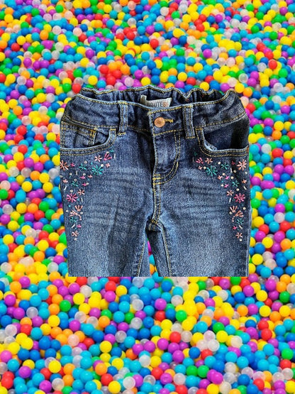 Route 66 distressed floral rhinestone skinny jeans provide a polished and stylish design