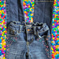 Route 66 distressed floral rhinestone skinny jeans provide a polished and stylish design
