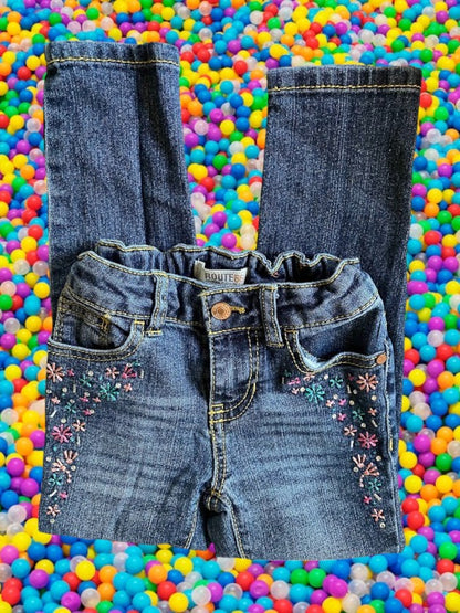 Route 66 distressed floral rhinestone skinny jeans provide a polished and stylish design