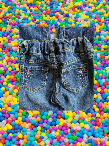 Route 66 distressed floral rhinestone skinny jeans provide a polished and stylish design