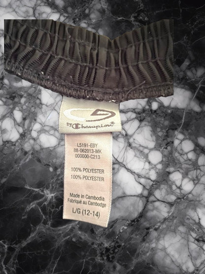 These C9 by Champion athletic shorts for boys are made with an elastic waistband and feature the iconic C9 logo on the leg.
These athletic shorts are perfect for wearing to school, to the gym, or for a fun summer workout.
With their high-quality construction and comfortable fit, your child will be able to move around freely and stay cool and comfortable all day long.