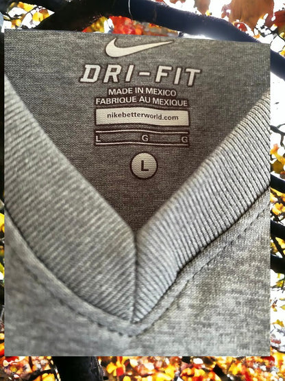 The Nike Dri-Fit V-Neck Top with vibrant logo colors