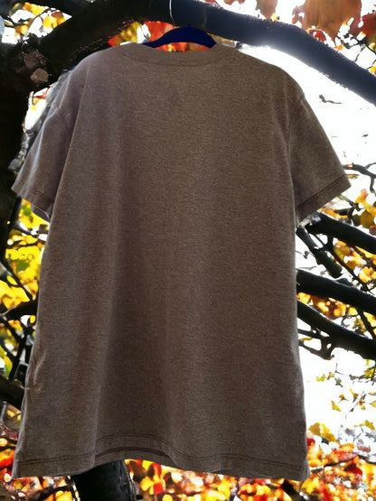 The Nike Dri-Fit V-Neck Top with vibrant logo colors