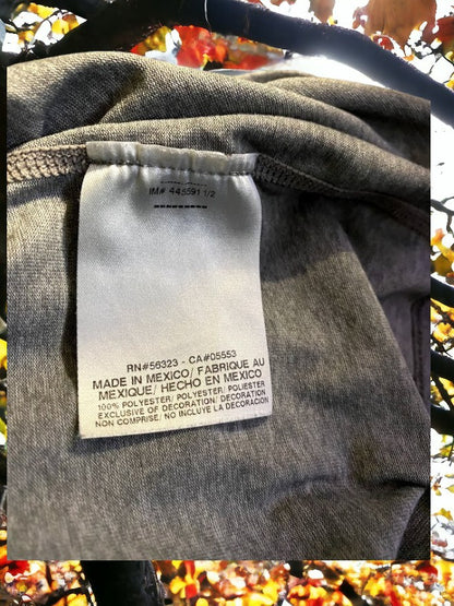 The Nike Dri-Fit V-Neck Top with vibrant logo colors