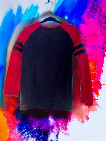 This girl's graphic tee features a crew neck and trendy striped design in a variety of bright colors