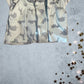 This Little Me Footed Animal Cotton Onesie features a charming powder blue design with animal motifs