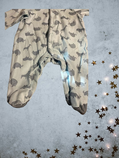 This Little Me Footed Animal Cotton Onesie features a charming powder blue design with animal motifs