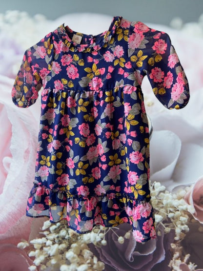 Route 66 floral ruffle dress with vibrant floral designs and elegant ruffled sleeves