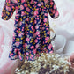 Route 66 floral ruffle dress with vibrant floral designs and elegant ruffled sleeves