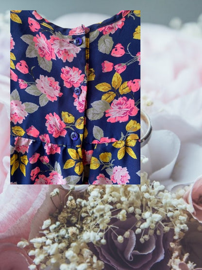 Route 66 floral ruffle dress with vibrant floral designs and elegant ruffled sleeves