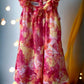 This Blueberi Boulevard dress features a colorful floral design and has flowers around the neckline