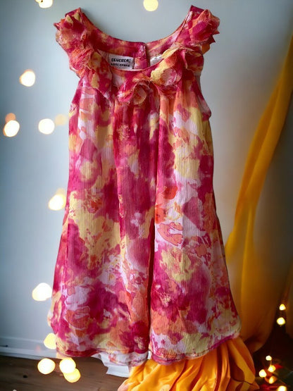 This Blueberi Boulevard dress features a colorful floral design and has flowers around the neckline