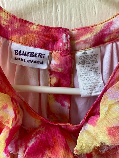 This Blueberi Boulevard dress features a colorful floral design and has flowers around the neckline