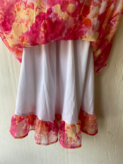 This Blueberi Boulevard dress features a colorful floral design and has flowers around the neckline