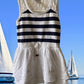 This Tahari's girl's dress boasts a stylish stripe design and a charming ruffle and floral bottom