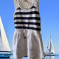 This Tahari's girl's dress boasts a stylish stripe design and a charming ruffle and floral bottom